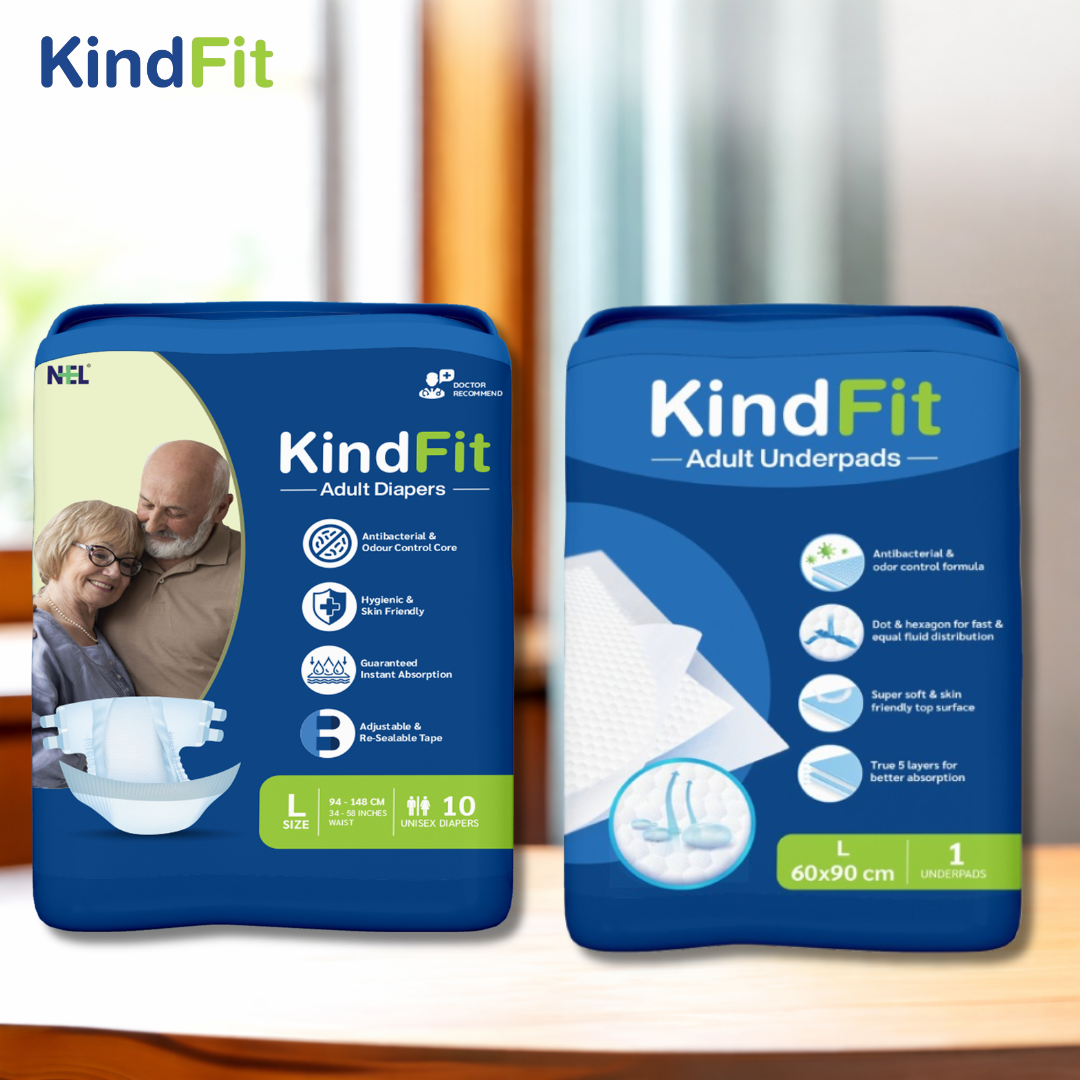 Front View Two packages of KindFit adult diapers on a wooden surface with a blurred background.


