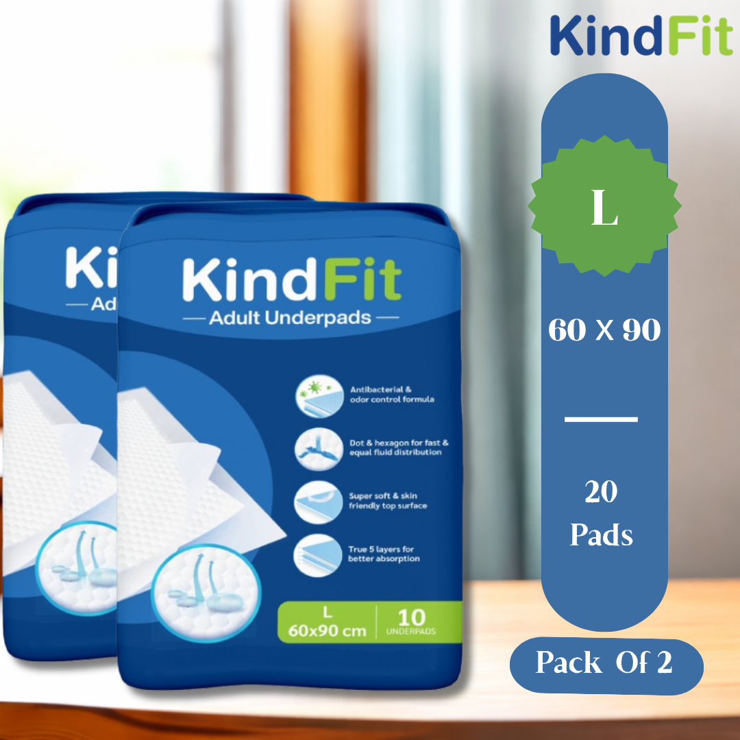 Two packages of KindFit adult underpads with packaging details on a wooden surface.

